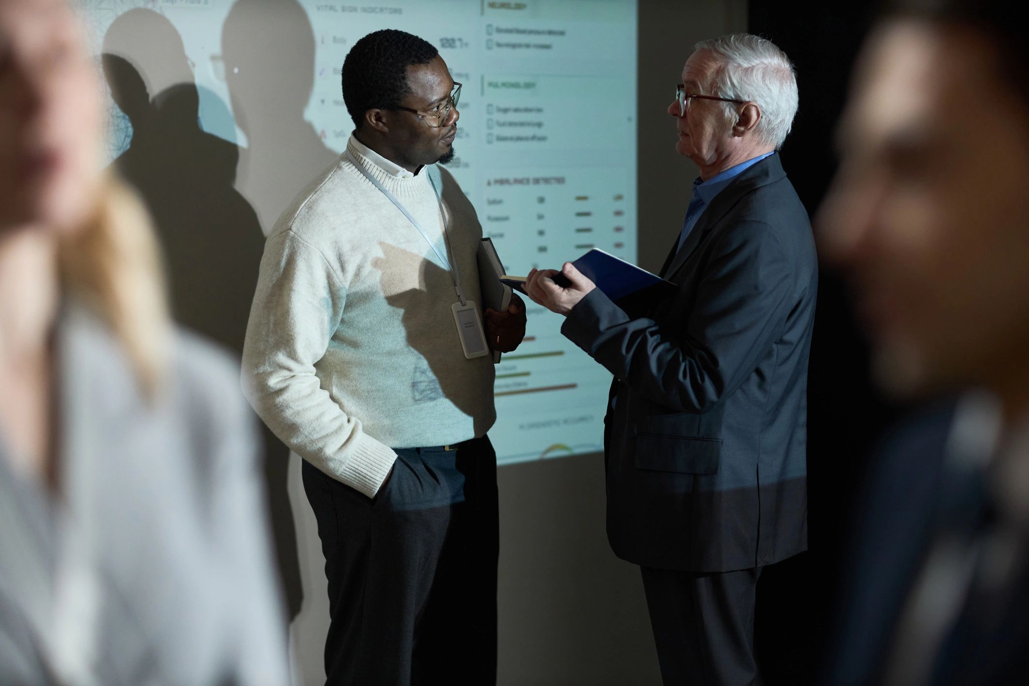 Executives reviewing presentation data during a training session